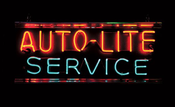 Auto-lite Service: OFFERED WITHOUT RESERVE AUTO-LITE SERVICE Metal; 25"x11"x6". Distinctive example of a smaller neon with chrome accents, promoting the American spark plug and ignition wire company. As n