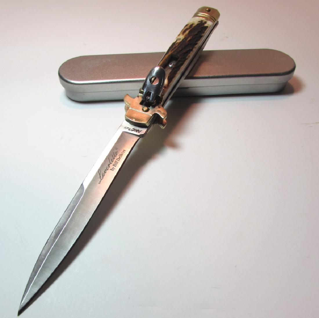 LEVERLETTO BY BILL DESHIVS AKC ITALY AUTO KNIFE: ITALIAN PUSH-BUTTON LEVERLOCK AUTOMATIC FOLDING POCKET KNIFE. GENUINE STAG HANDLES, BRASS & NICKEL HARDWARE. 4.25" BLADE, 9.5" OVERALL.