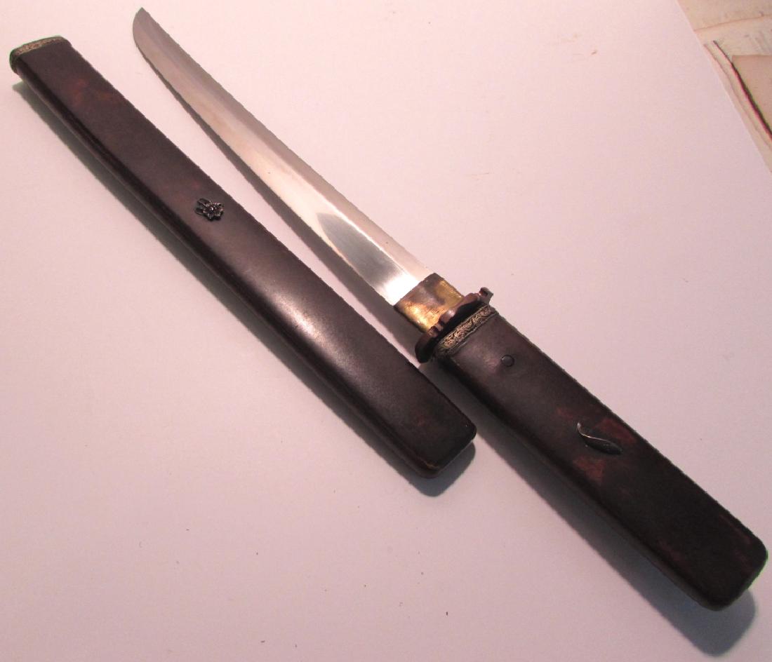 JAPANESE WAKIZASHI SWORD DAGGER KNIFE SIGNED MEI: JAPANESE WAKIZASHI KNIFE & SCABBARD. NICE WOOD TSUKA & SAYA, GOOD SOLID STEEL. 10.75" BLADE, 17.25" OVERALL. SHARP. STERLING SILVER CHRYSANTHEMUM & COY ACCENTS.