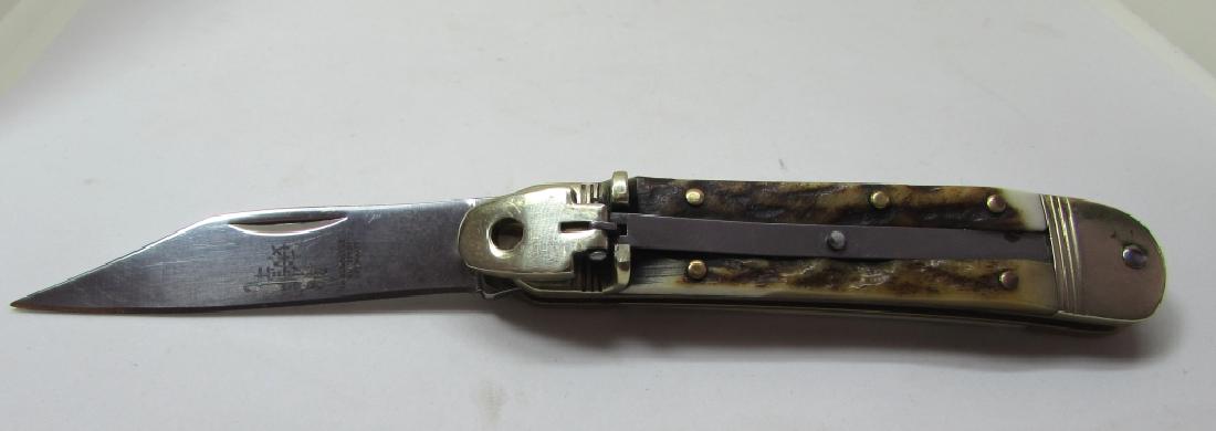 HUBERTUS SOLINGEN STAINLESS STAG SWITCHBLADE KNIFE: HUBERTUS AUTOMATIC POCKET KNIFE. 2 3/8" BLADE, 5 3/4" OVERALL. VERY SHARP.