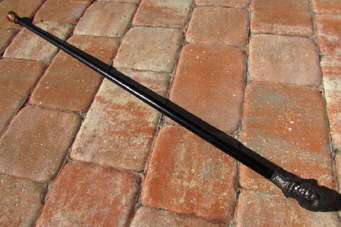 1896 PRES WILLIAM MCKINLEY CANE POLITICAL CAMPAIGN: 1896 "PROTECTION" PRESIDENT WILLIAM MCKINLEY WALKING CANE. PEWTER HANDLE, WOOD BODY, DAVOL RUBBER TIP. 35.25" TALL.