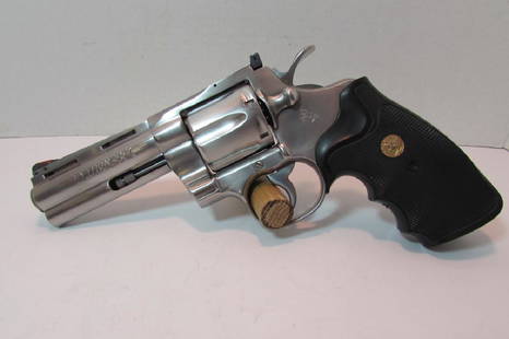 COLT PYTHON 357 MAGNUM REVOLVER STAINLESS 1986: '86 STAINLESS COLT PYTHON HAND GUN "PISTOL". 4" BARREL, 6 SHOT. INCLUDES ORIG. CASE & PAPERS. Ser. #T50107