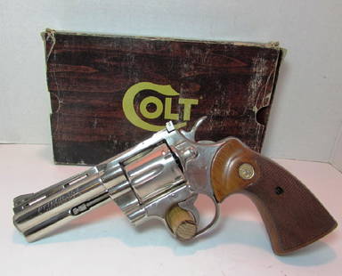 COLT PYTHON 357 MAG 4" NICKEL REVOLVER HANDGUN: COLT PYTHON HAND GUN "PISTOL". .357 MAGNUM CTG. CAL. 4" BARREL. NICKEL FINISH, WALNUT WOOD GRIPS, ADJUSTABLE REAR SIGHT. Serial # E16653