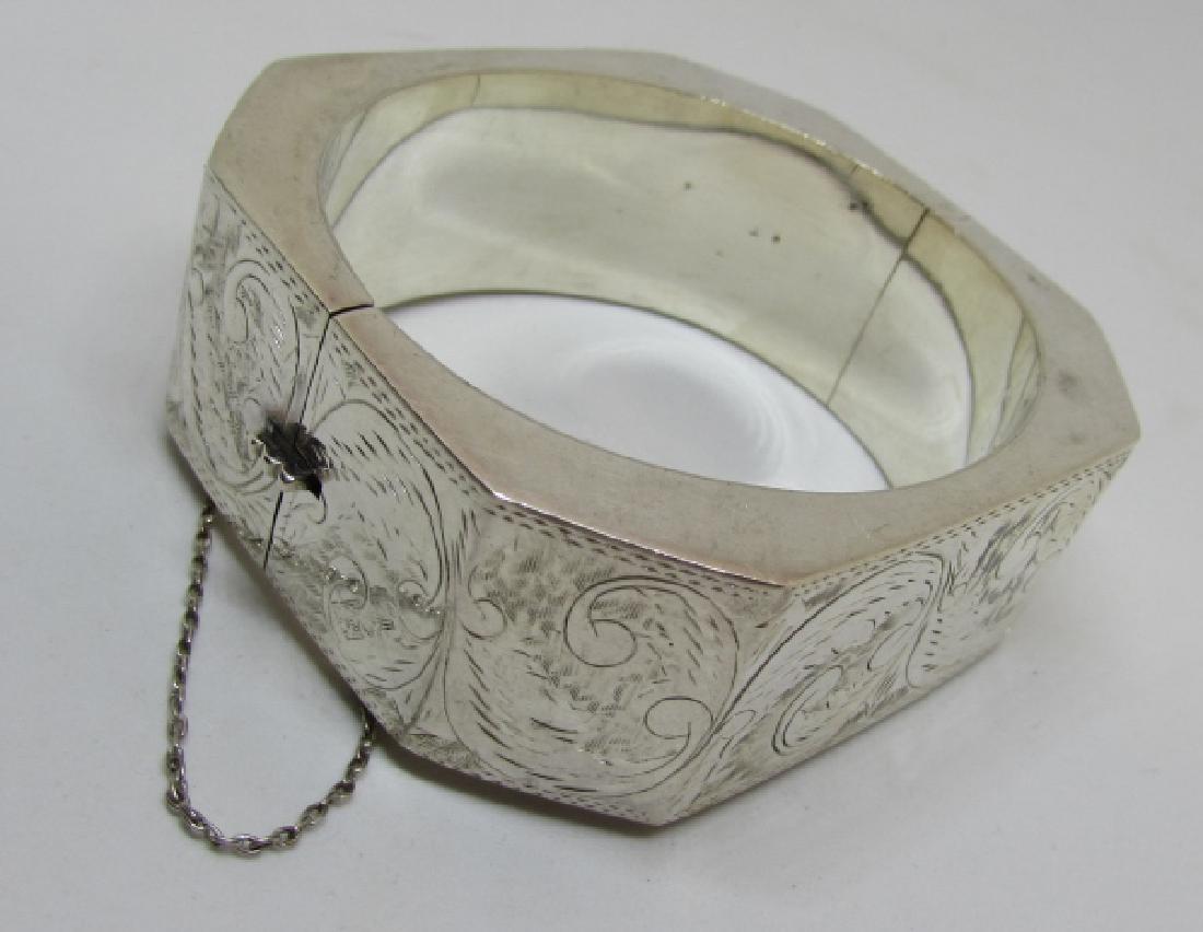 ETCHED BANGLE BRACELET STERLING SILVER 50 GRAMS: 25MM THICK 8 SIDED CUFF. OPENS FOR EASY ON AND OFF. HAS A SAFETY CHAIN. EXCELLENT VINTAGE ESTATE CONDITION. (USA SHIPPING $8)