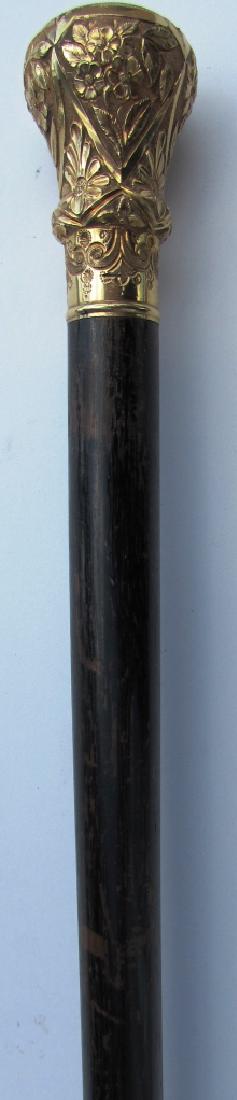 GOLD TOP PRESENTATION CANE ANTIQUE EBONY WOOD: GOLD TOPPED EBONY WALKING STICK. 36 3/8" TALL. TOP IS 2 3/8" TALL, 1 3/8" WIDE. (USA SHIPPING $20)