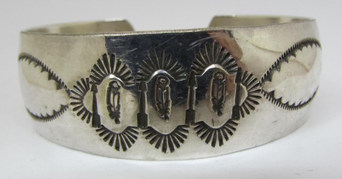 SIGNED M STERLING SILVER CUFF BRACELET NAVAJO: MELISSA YAZZIE OR ARNOLD MALONEY NATIVE AMERICAN 20MM WIDE. WEIGHS 25 GRAMS. 3 FEATHER DESIGN, CURRENTLY FITS A 7" WRIST. CAN BE ADJUSTED LARGER OR SMALLER. EXCELLENT CONDITION. (USA SHIPPING $8)