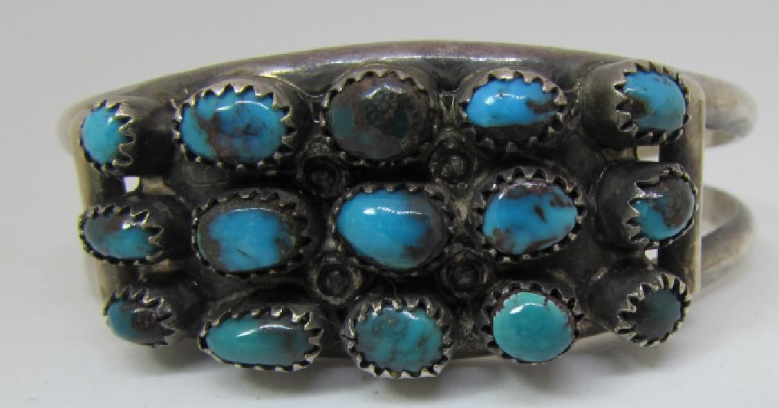 OLD PAWN COIN SILVER TURQUOISE CUFF BRACELET SIGNE: HALLMARKED LOOKS LIKE "UZ" NAVAJO NATIVE AMERICAN. 21MM WIDE TOP. WEIGHS 28.3 GRAMS. CURRENTLY FITS A 7 " WRIST; CAN BE ADJUSTED LARGER OR SMALLER. (USA SHIPPING $10)