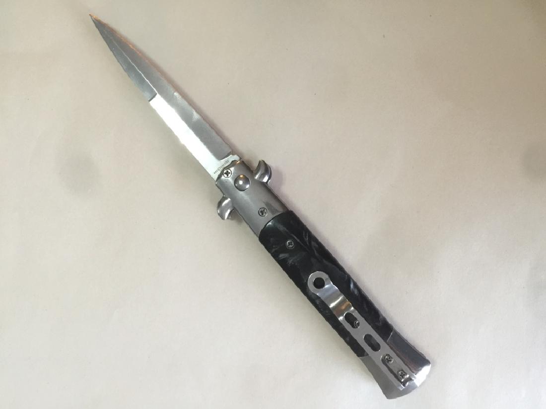 9" SWITCHBLADE AUTOMATIC KNIFE: BLADE MEASURES 3.75". TOTAL LENGTH 9". EXCELLENT CONDITION. BLACK HANDLE. PUSH BUTTON.