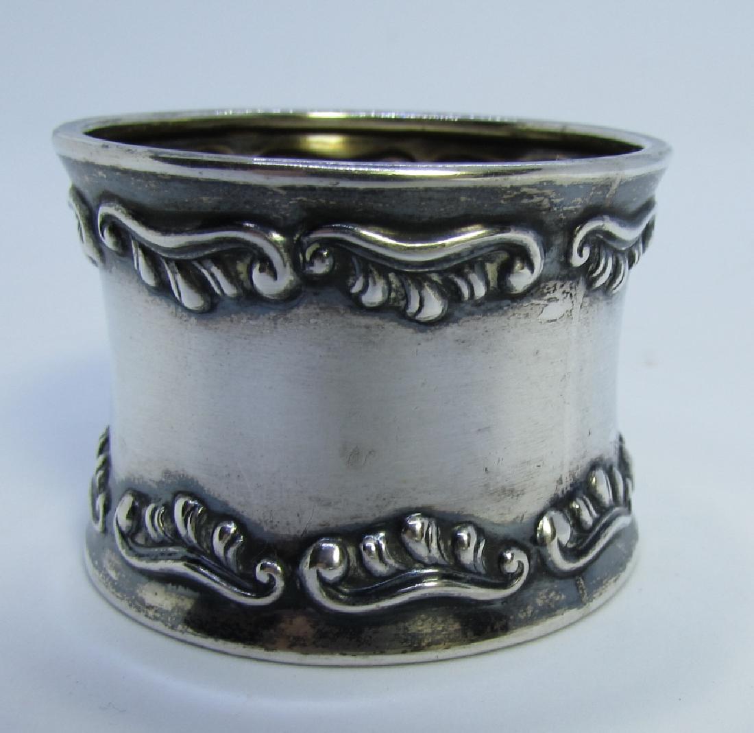 H FISCHER DENMARK 830 STERLING SILVER NAPKIN RING: ANTIQUE HALLMARKED REPOUSSE HOLGER FISCHER COPENHAGEN, DENMARK. CIRCA 1900. 34MM X 47MM. WEIGHS 14.8 GRAMS. MONOGRAMED "D". EXCELLENT CONDITION. (USA SHIPPING $6)