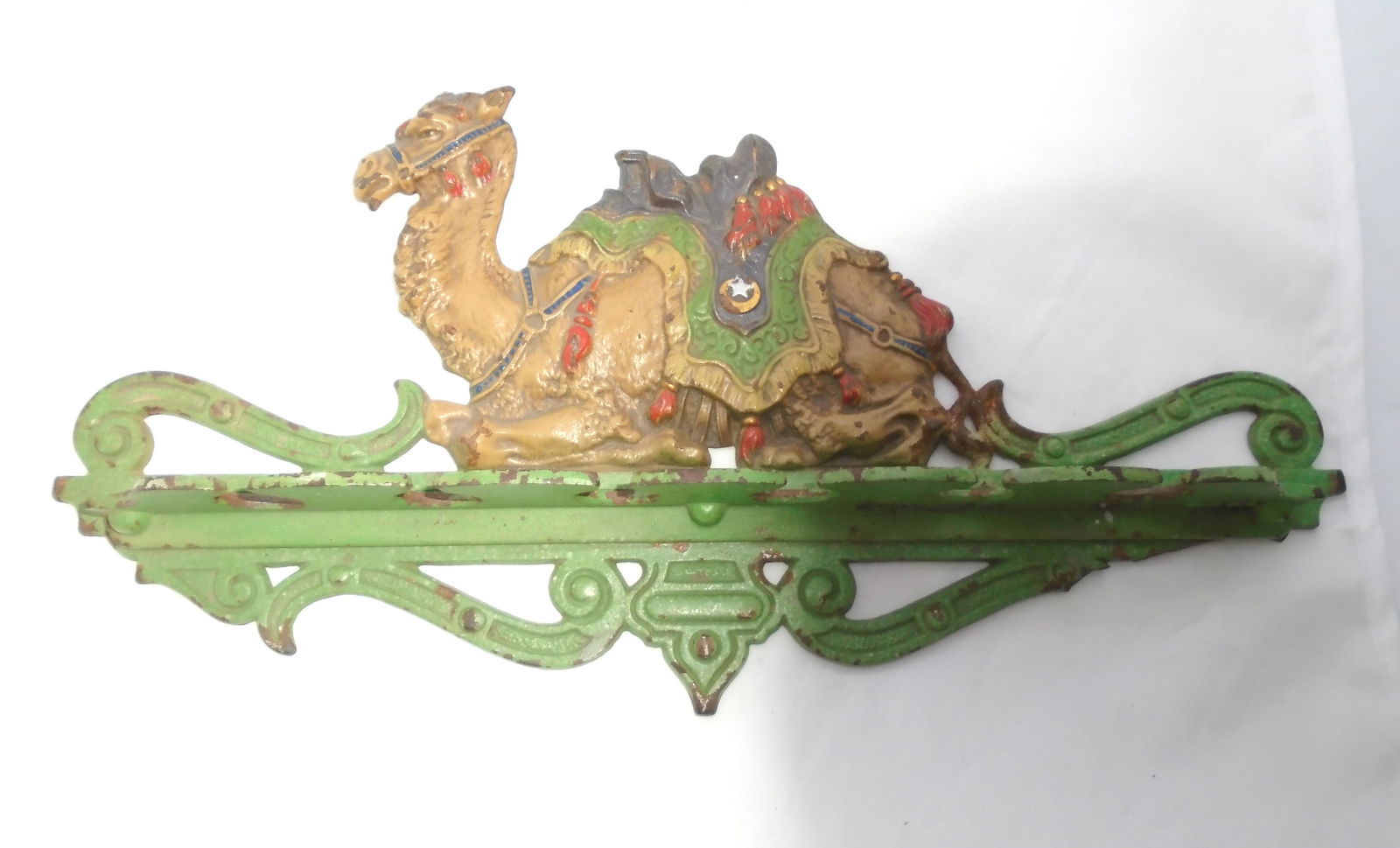 ANTIQUE SHRINERS CAMEL PIPE CUE HOLDER RACK 1920'S: BEAUTIFUL ORIGINAL TURKISH DESIGN PAINTED CAST IRON WALL MOUNT, COULD BE USED FOR POOL TABLE CUES PIPES OR COAT HANGER. MARKED "2809" & "1598". 13" LONG, 7" TALL, 1.75" WIDE. HAS ALMOST ALL OF IT'S OR