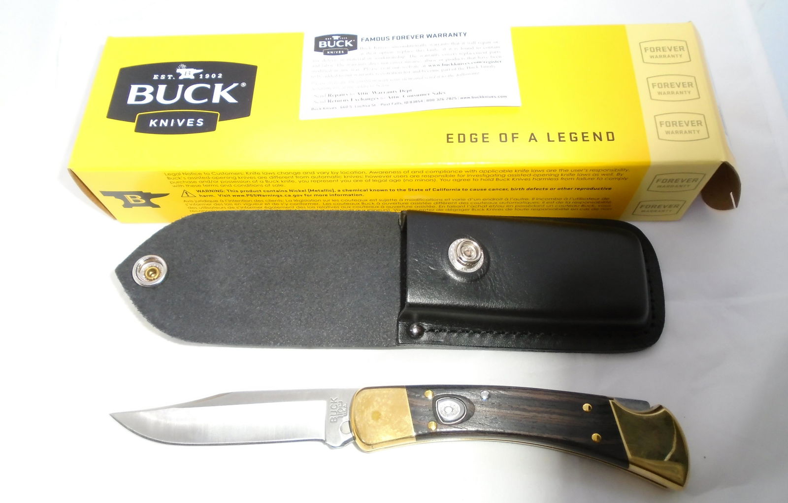 BUCK SWITCHBLADE KNIFE 110 w BOX LEATHER SHEATH: BUCK 110 PUSH-BUTTON AUTO POCKET KNIFE. LIKE NEW WITH BOX, LEATHER SHEATH, & PAPER. 3 3/4" BLADE, 8 9/16" OVERALL. (USA SHIPPING $10)