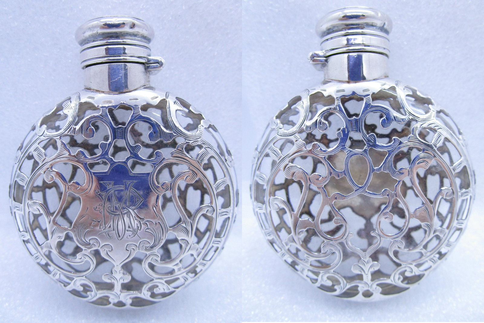 STERLING SILVER OVERLAY CRYSTAL FLASK 1890 BOTTLE: AMERICAN ANTIQUE GLASS CONTAINER 68MM BY 85MM BY 24MM. HAS A CORK INSERT WITH A SCREWING LOCKING TOP. MARKED "STERLING SILVER D2099" ALL HAND ENGRAVED; EXCELLENT CONDITION. MONGRAM RM. (USA SHIPPING $