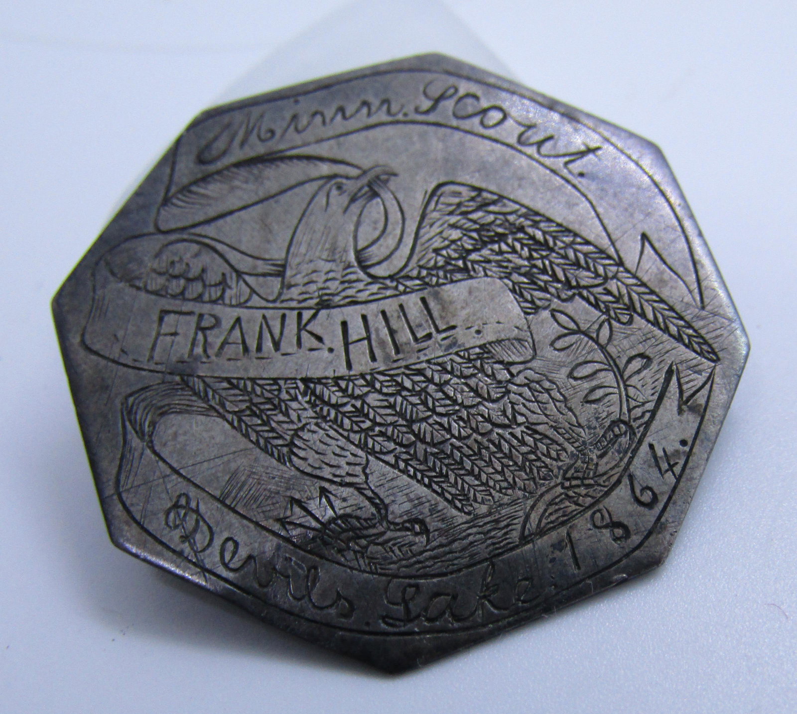 CIVIL WAR MINN SCOUT PIN DEVILS LAKE 1864 BADGE: HAND ENGRAVED PIN, MEDAL OR BADGE DATED 1864 TO FRANK HILL MINN SCOUT DEVIL'S LAKE , 1 1/4' BY 1 1/4 ". MADE OF STERLING OR COIN SILVER. MINNESOTA CAVALRY 1864 (USA SHIPPING $10)