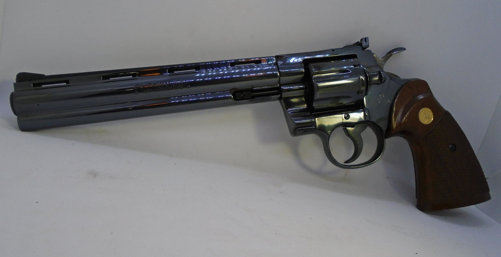 1981 COLT PYTHON 8" ROYAL BLUE HANDGUN 357 MAG: '81 COLT PYTHON HAND GUN "PISTOL." 8" BARREL, .357 MAGNUM CAL. 6 SHOT, SINGLE/DOUBLE ACTION. INCLUDES COLT CASE & PAPERS. SER. # (K20219). FFL REQUIRED, $65 SHIPPING & FFL.