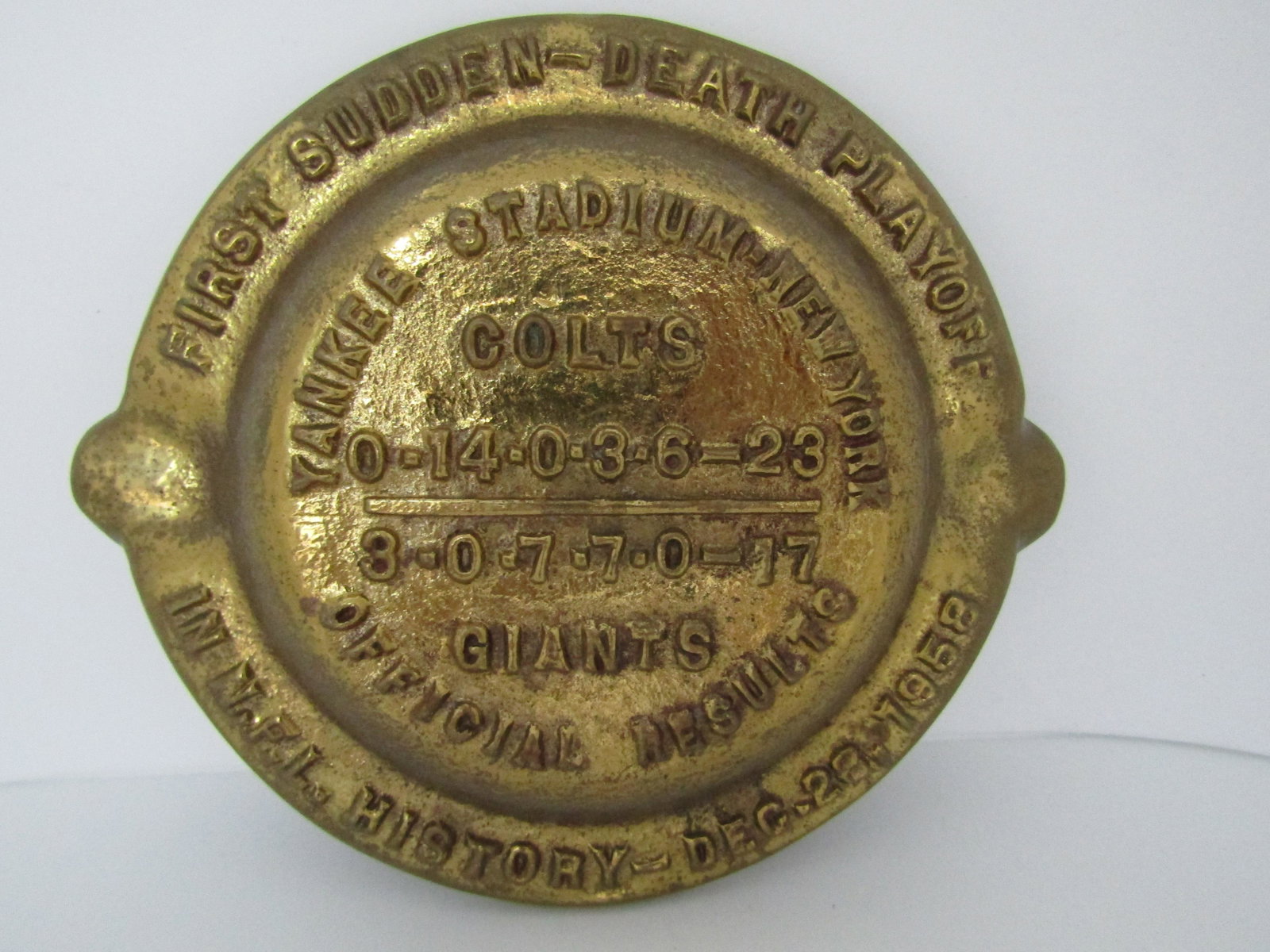 1958 BALTIMORE COLTS NFL WORLD CHAMPIONS FOOTBALL: TOBACCIANA, PIPE REST 5.5 INCH WIDE BRASS ADVERTISEMENT ASHTRAY DISH FOR the National Football League Championship game, which was the first NFL playoff game to go into a "Sudden Death" overtime and i