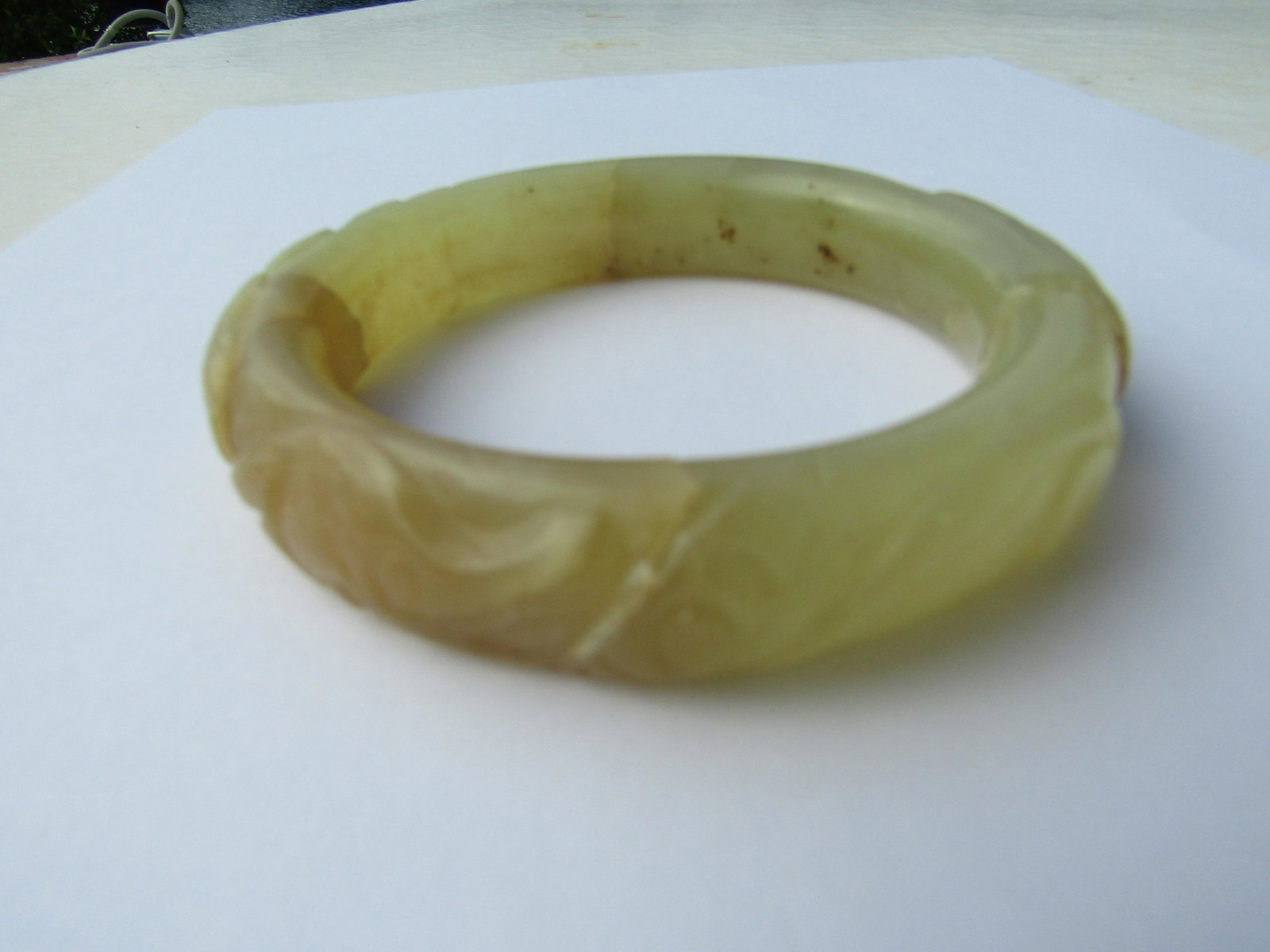 CARVED JADE BANGLE BRACELET ANTIQUE REPAIRED: 15MM WIDE ANTIQUE CARVED STONE BANGLE THAT WAS BROKEN AND REPAIRED. INTRERNAL CIRCUMFERENCE 7.5". WEIGHS 79 GRAMS. USA SHIPPING $10.