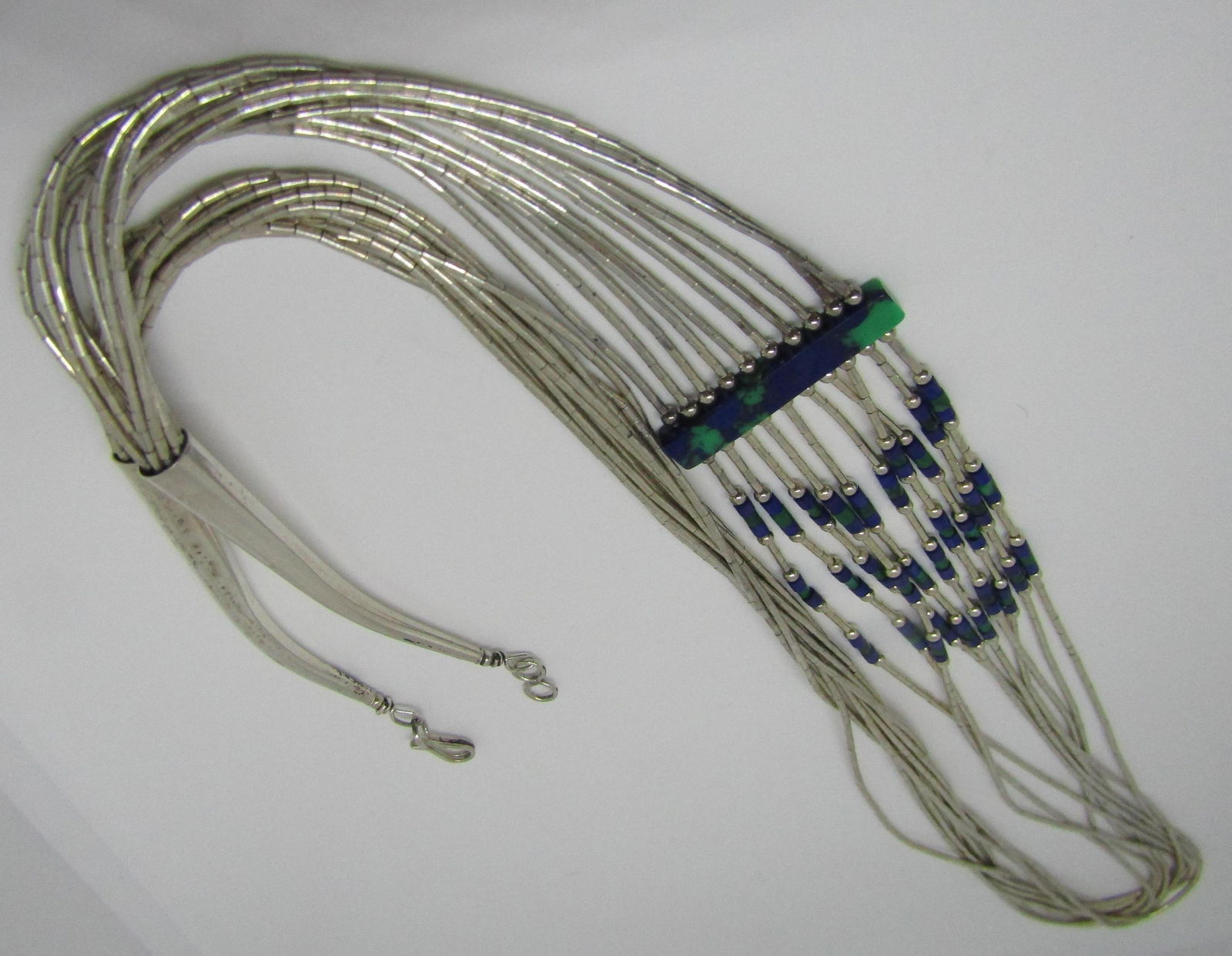 10 STRAND NECKLACE STERLING LIQUID SILVER AZURITE: VINTAGE ESTATE NATIVE AMERICAN SOUTHWEST NAVAJO INDIAN JEWELRY. 10 STRAND AZURITE, MALACHITE HEISHI MEASURES 27 INCHES LONG. WEIGHS 32 GRAMS MARKED STERLING. EXCELLENT USED CONDITION. USA SHIPPING $5.
