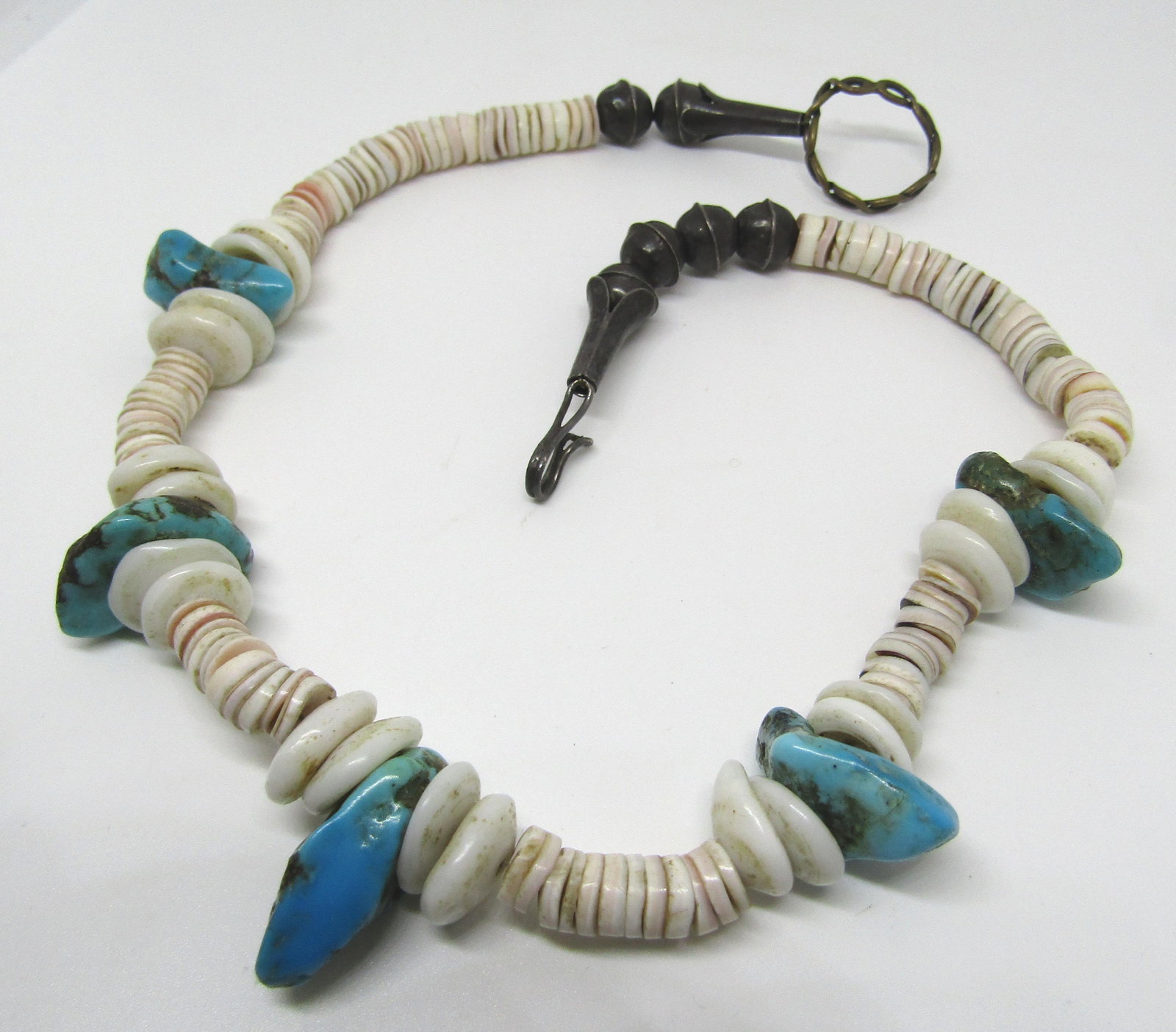 HEISHI SHELL TURQUOISE NECKLACE STERLING SILVER: STERLING BEADS, TWO TYPES OF SHELL SOME HAVE PINK TINT, AND 5 TURQUOISE STONES. CENTER STONE IS 22MM, SMALL SHELLS ARE 7MM. NATIVE AMERICAN CHOKER. MEASURES 15.5" LONG. (USA SHIPPING $5)