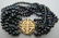 14K GOLD & 7 STRAND BLACK PEARL BRACELET