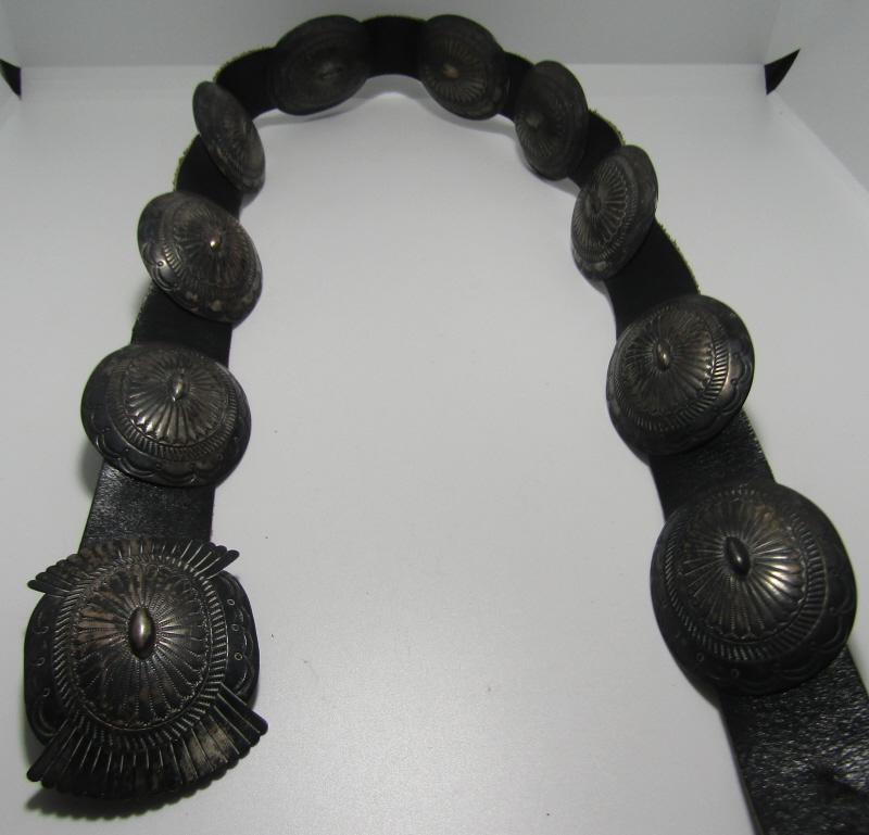 38.5" CONCHO BELT STERLING SILVER HAND STAMPED: BEAUTIFUL HAND STAMPED WORK, WEIGHS 212 GRAMS TOTAL. NATIVE AMERICAN SOUTHWEST INDIAN JEWELRY. UNMARKED, TESTED STERLING SILVER WITH 9 OVAL CONCHOS (62 X 49MM) AND 1 BUCKLE (67 X 50MM). 38.5 INCHES LO