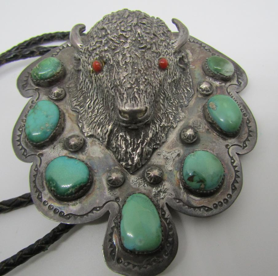 MARK SD TURQUOISE BUFFALO BOLO TIE STERLING SILVER: 3D BISON OLD PAWN HAND STAMPED NECKLACE; HALLMARKED "SD". WEIGHS 119.3 GRAMS OF TESTED STERLING SILVER & LEATHER. VINTAGE ESTATE NATIVE AMERICAN SOUTHWEST INDIAN JEWELRY. BEZEL MOUNTED WITH 2 RED CORA