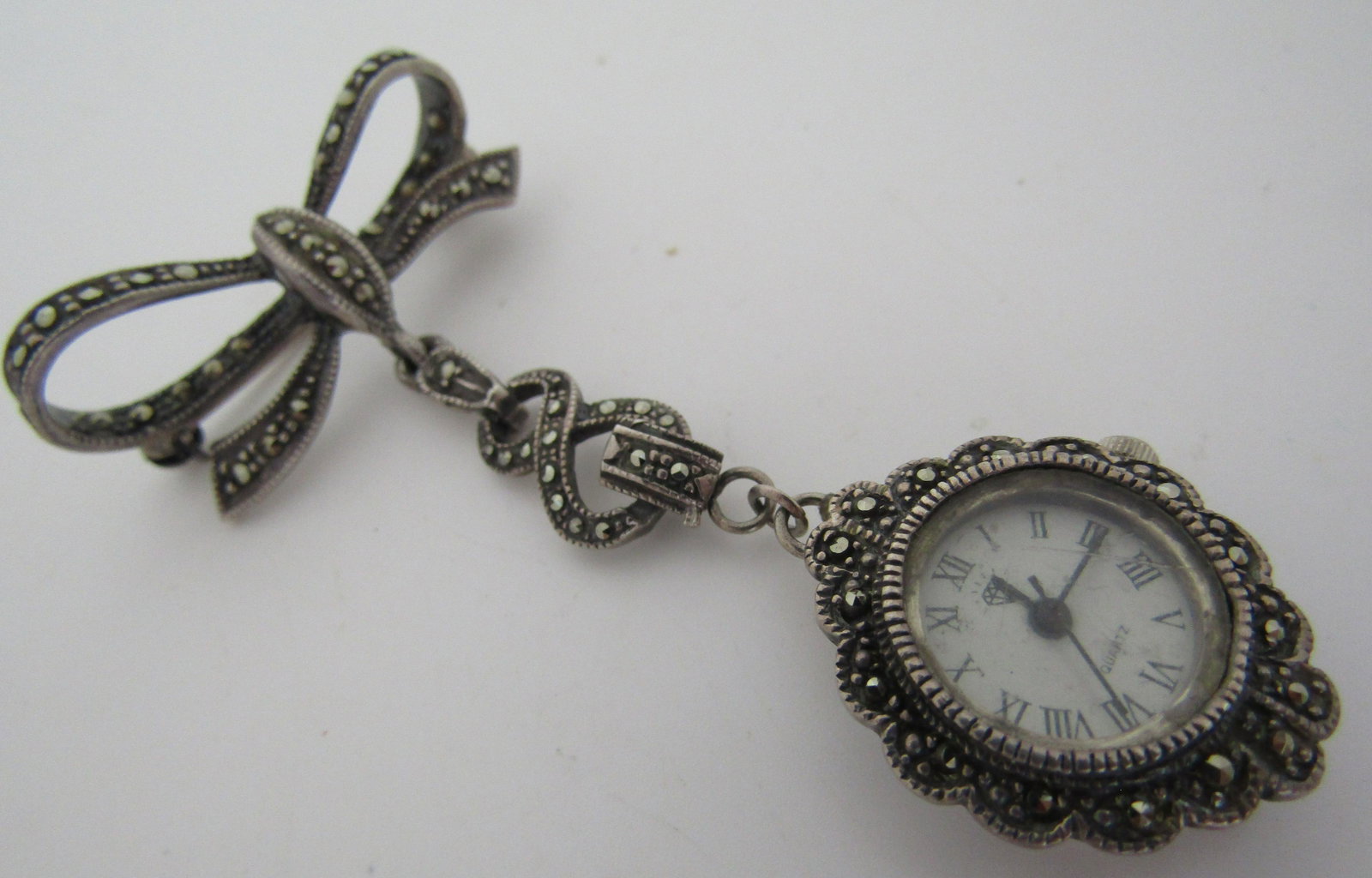 MARCASITE LAVALIER WATCH PIN STERLING SILVER BROOC: VINTAGE ESTATE LAVALIER MARCASITE PIN. WATCH 19MM. PIN 31MM WIDE X 66MM LONG. WEIGHS 16.9 GRAMS. USA SHIPPING $5.