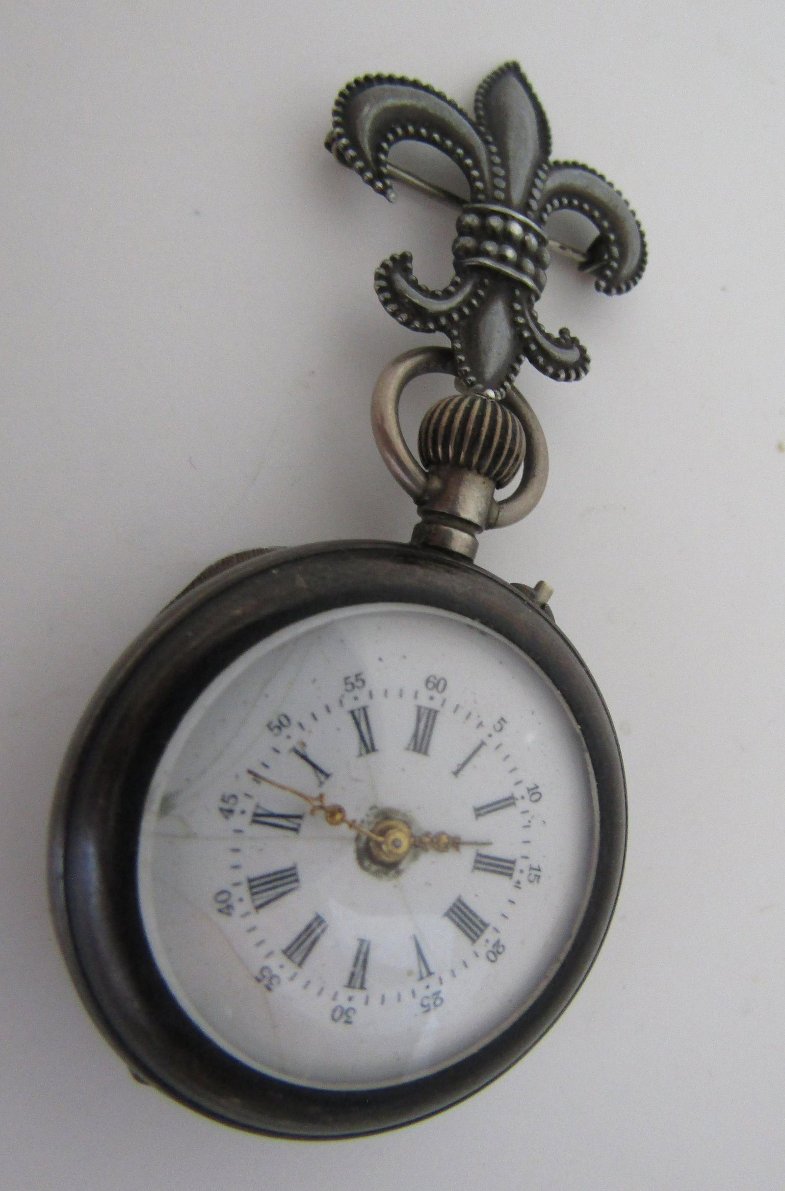 LAVALIER PIN POCKETWATCH STERLING SILVER WATCH: ANTIQUE VINTAGE ESTATE FLEUR DE LIS LAVALIER PIN. WATCH 27MM WIDE X 41MM LONG. PIN 18.5MM WIDE X 25MM LONG MARKED STERLING. TOTAL WEIGHT 29.8 GRAMS. USA SHIPPING $5.
