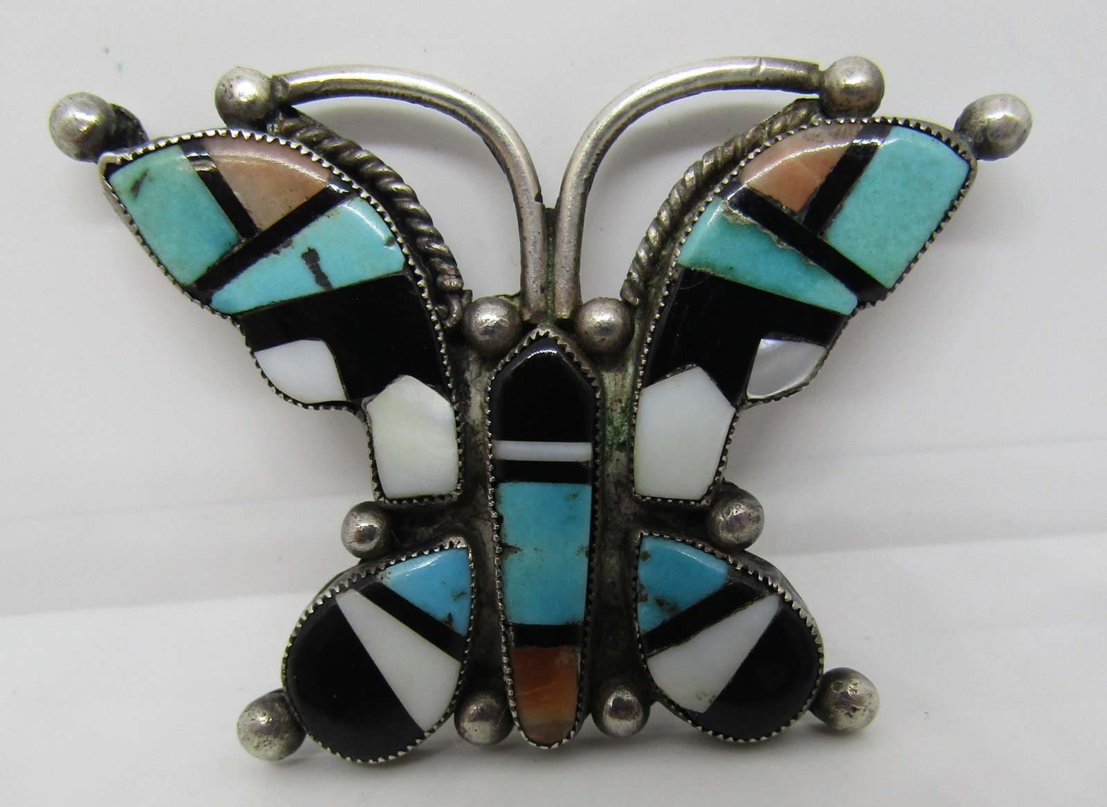 ZUNI BUTTERFLY INLAY PIN STERLING SILVER TURQUOISE: OLD PAWN BROOCH WITH INLAID: TURQUOISE, SPINY OYSTER SHELL, MOP AND JET. NATIVE AMERICAN SOUTHWEST INDIAN JEWELRY. 52MM BY 38MM. WEIGHS 14.6 GRAMS, NO MARK, TESTED STERLING. VINTAGE ESTATE CONDITION. 