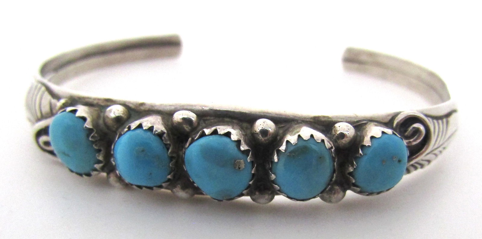 LIVINGSTON TURQUOISE CUFF BRACELETSTERLING SILVER: OLD PAWN GEM SAW TOOTH TURQUOISE BRACELET MARKED "J STERLING" JASON LIVINGSTON NATIVE AMERICAN SOUTHWEST NAVAJO INDIAN JEWELRY. WEIGHS 10 GRAMS. 10MM WIDE. VINTAGE ESTATE EXCELLENT USED CONDITION. USA