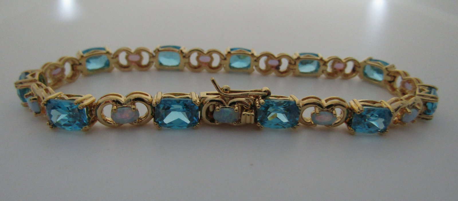BLU TOPAZ OPAL CZ BRACELET GOLD ON STERLING SILVER: VINTAGE ESTATE BRACELET MEASURES 8 1/2 INCHES LONG BY 6.4MM WIDE. INTENDED FOR A 8" WRIST. WEIGHS 20.8 GRAMS. EXCELLENT CONDITION. USA SHIPPING $5.