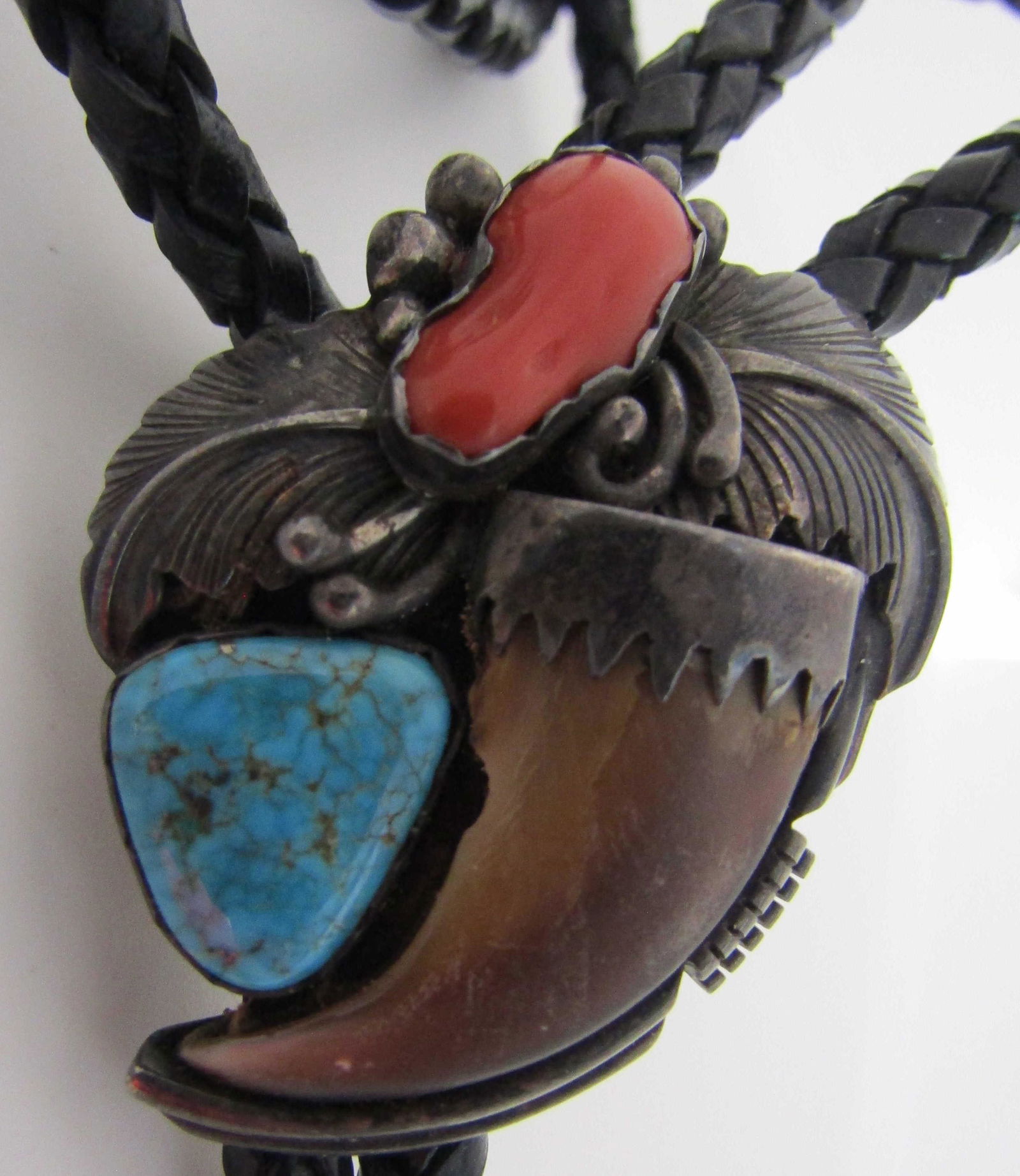 TOM BEAR CLAW TURQUOISE CORAL BOLO TIE NECKLACE: SQUASH BLOSSOM BEAR CLAW, TURQUOISE & CORAL MARKED "STERLING TD" TOM DAVID. OLD PAWN NATIVE AMERICAN SOUTHWEST NAVAJO INDIAN JEWELRY. WEIGHS 35.3 GRAMS TOTAL. PENDANT MEASURES 43MM BY 33MM. BRAIDED LE