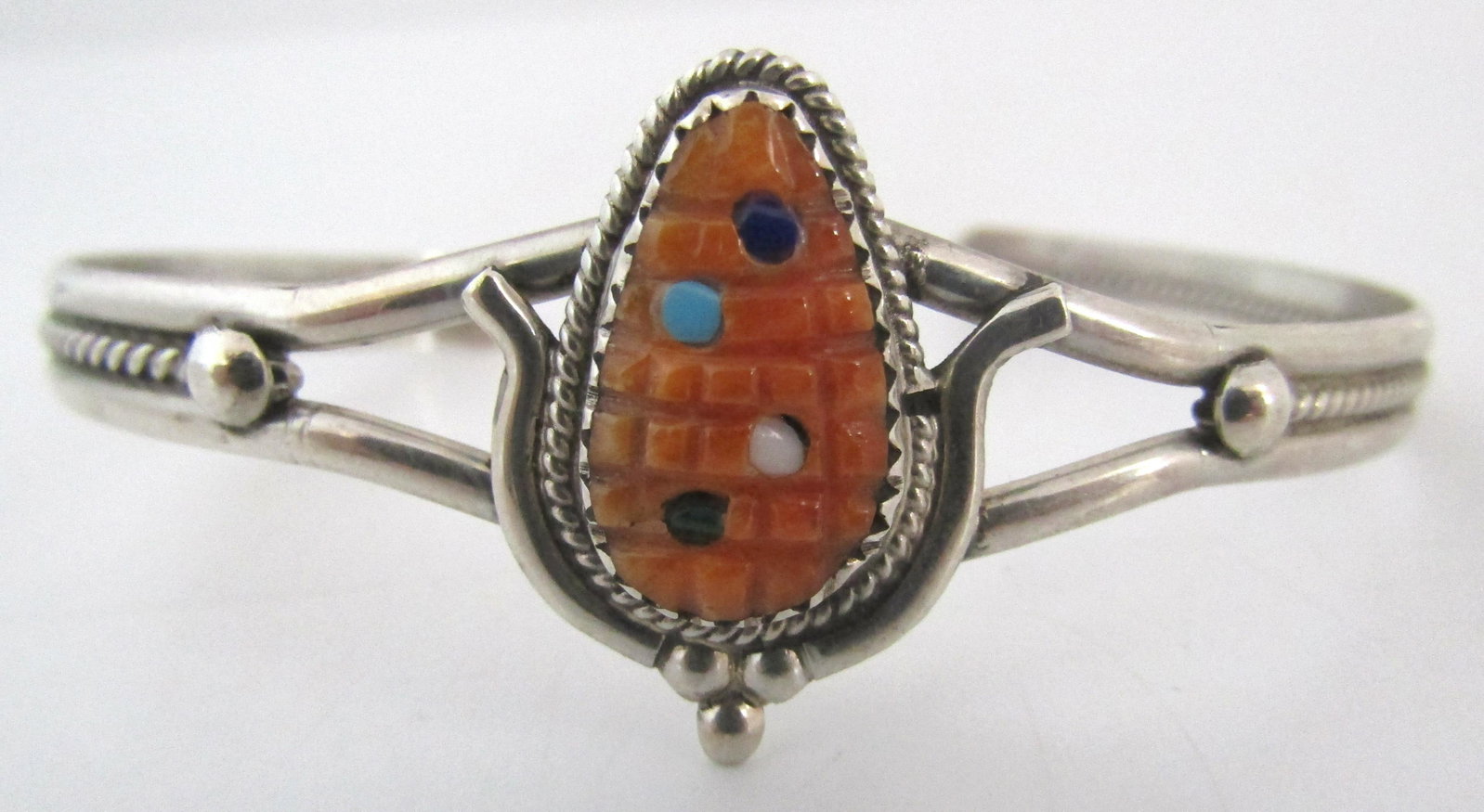 ETSATE TURQUOISE CUFF BRACELET STERLING SILVER: CARVED CORN STONE INLAY WITH MOP & TURQUOISE. SIGNED "B ETSATE ZUNI". OLD PAWN NATIVE AMERICAN SOUTHWEST INDIAN JEWELRY. TOP MEASURES 23MM WIDE. WEIGHS 10.6 GRAMS. FITS A 7 INCH WRIST WITH A 27MM GAP.
