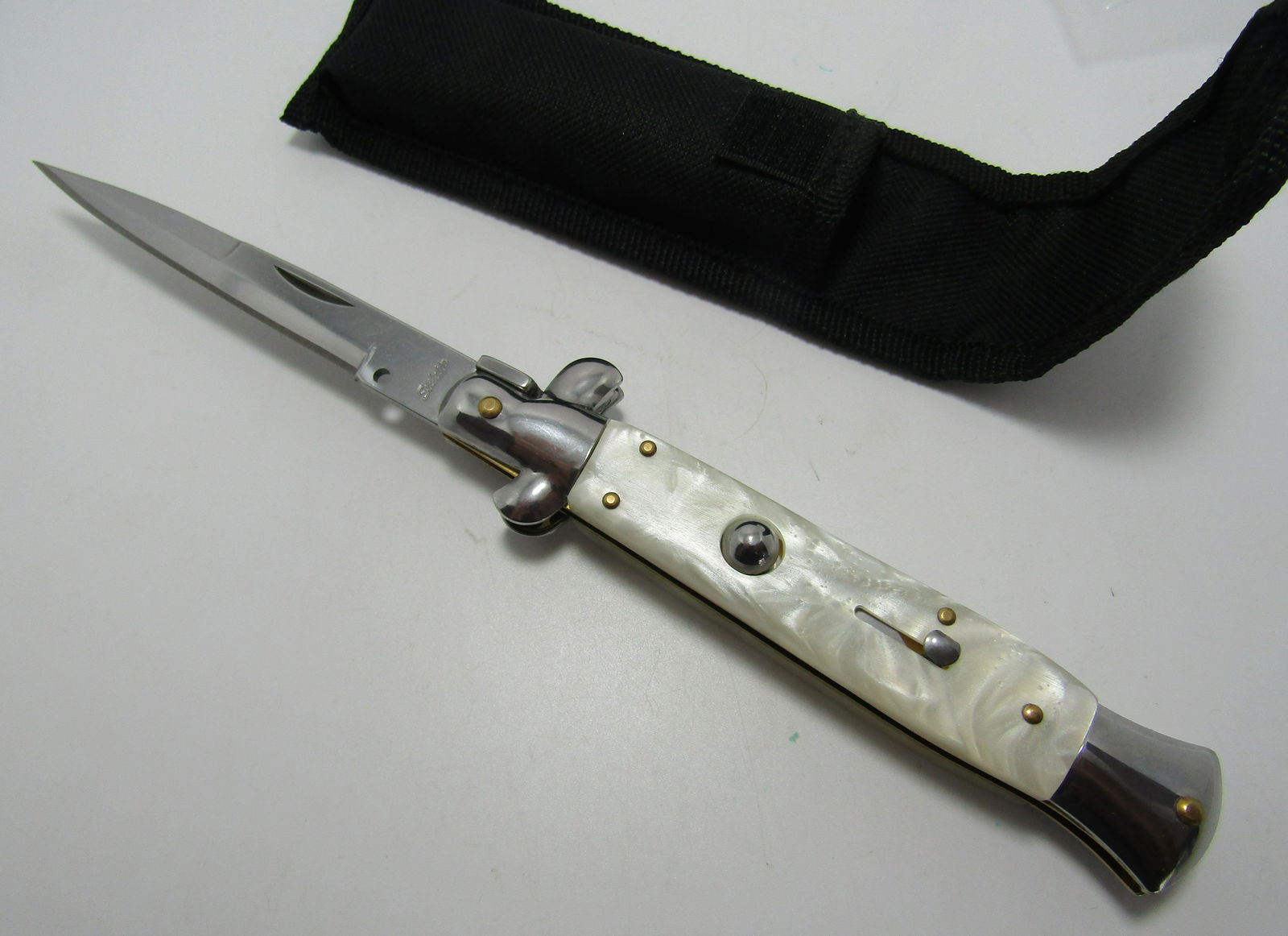PUSH BUTTON SWITCH BLADE KNIFE STILETTO: SWITCHBLADE KNIFE 9 1/2 INCH WITH 4 INCH BLADE. WHITE PEARLIZED GRIP STAINLESS STEEL BLADE. USA SHIPPING $5