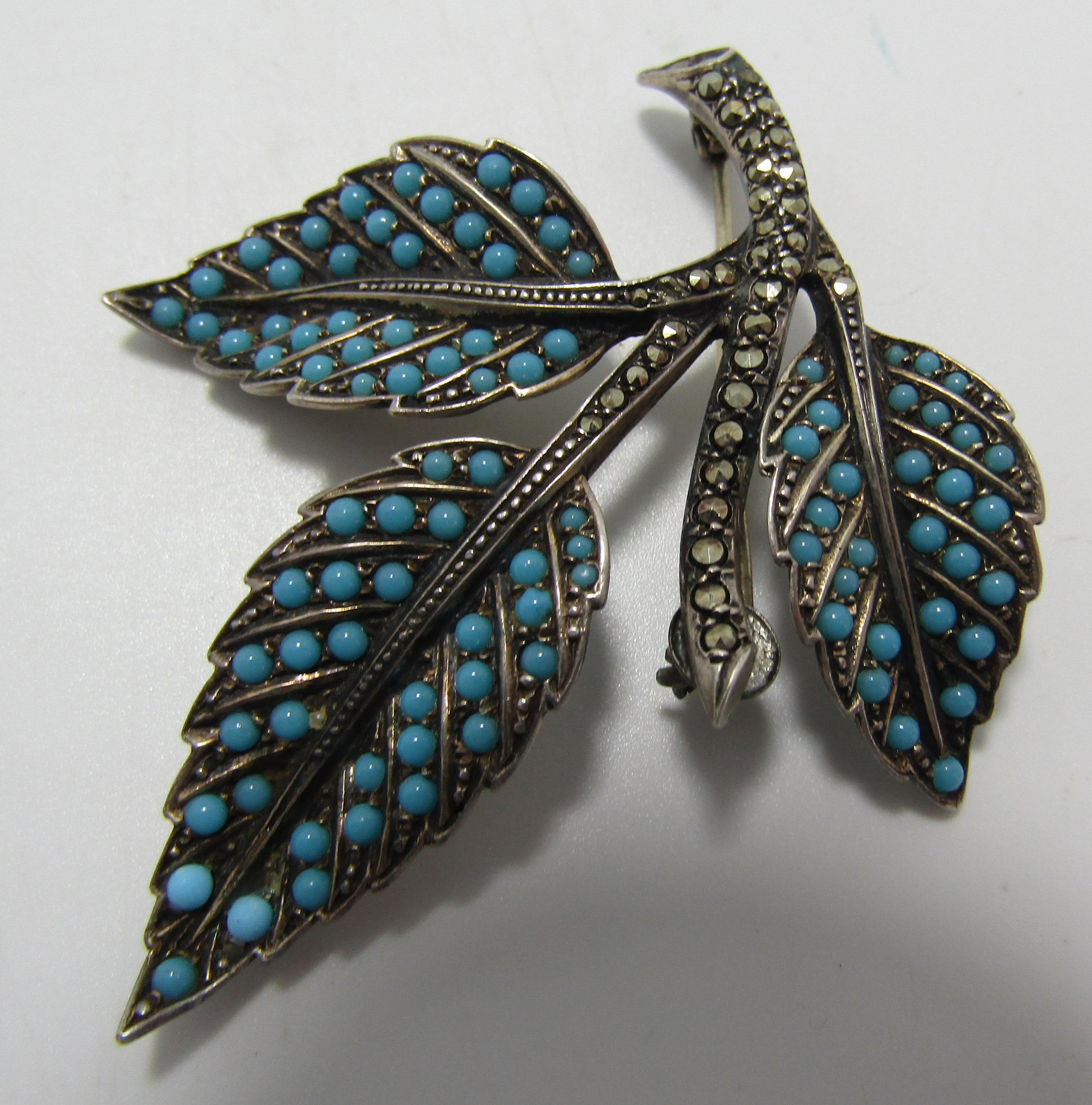 TURQUOISE MARCASITE PIN GERMANY STERLING SILVER: ANTIQUE FLOWER PIN SIGNED "STERLING SILVER GERMANY". WEIGHS 13 GRAMS. 150 STONES, EXCELLENT CONDITION. USA SHIPPING $5.