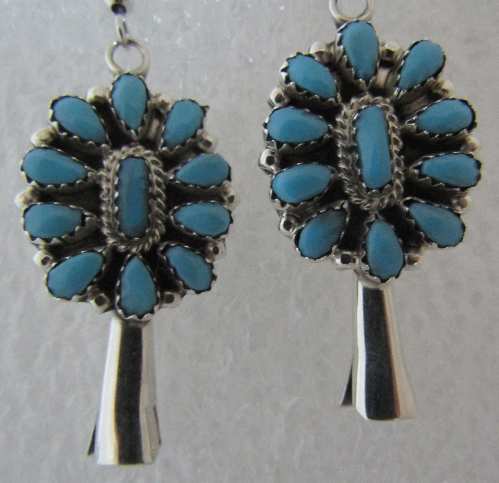 TURQUOISE EARRINGS SQUASH BLOSSOM STERLING SILVER: ARNOLD MALONEY SLEEPING BEAUTY TURQUOISE CLUSTER EARRINGS MARKED "STERLING M" NATIVE AMERICAN SOUTHWEST NAVAJO INDIAN JEWELRY. MEASURE 55MM LONG BY 19MM WIDE. WEIGH 7.2 GRAMS. EXCELLENT CONDITION. USA