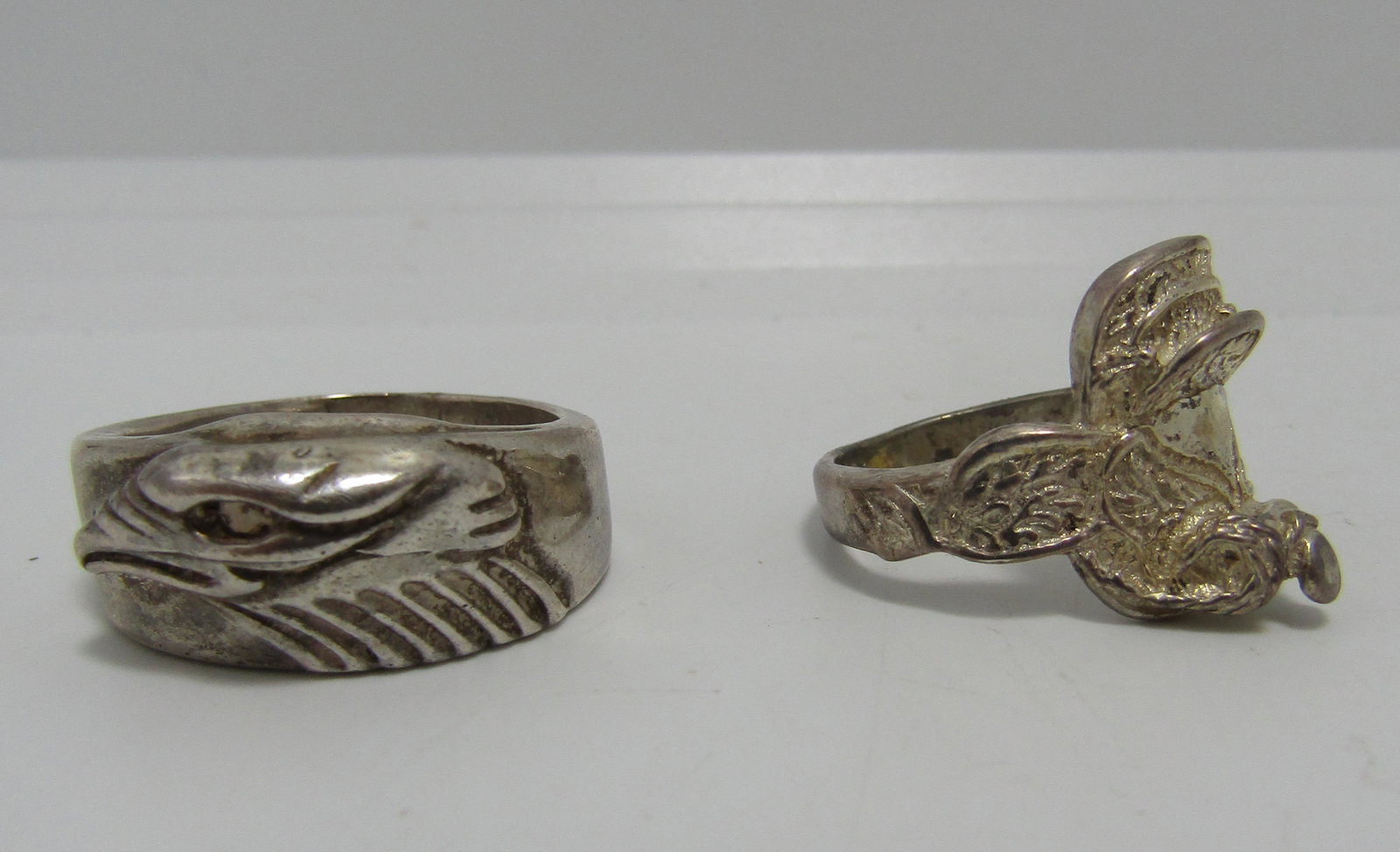 TWO STERLING SILVER RINGS EAGLE & SADDLE 18G: VINTAGE SOUTHWESTERN RINGS. UNSIGNED. BOTH TESTED AND MARKED 925 STERLING SILVER. BALD EAGLE HEAD RING SIZE 10, HORSE SADDLE RING SIZE 8. WEIGHS 18 GRAMS TOTAL. USA SHIPPING $5.