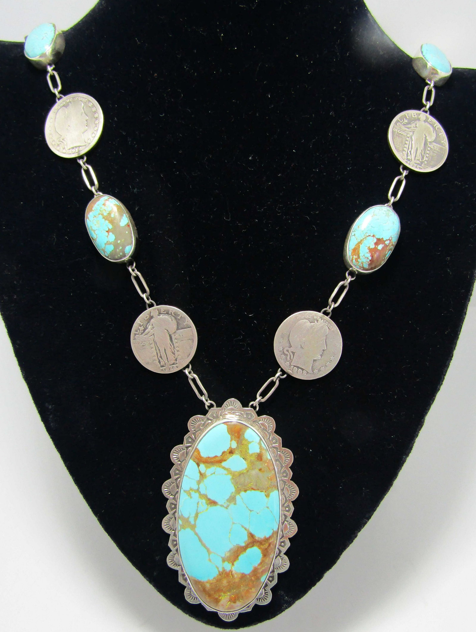 SAN FELIPE TURQUOISE NECKLACE STERLING SILVER 133G: NUMBER 8 TURQUOISE WITH US SILVER COINS: 1902, 1909, 1914, 1925, 1926,1930. SIGNED " SAN FELIPE JACOB TRONCOSA STERLING" SILVER. NATIVE AMERICAN SOUTHWEST INDIAN JEWELRY. 32 INCHES LONG PLUS A 81MM LO