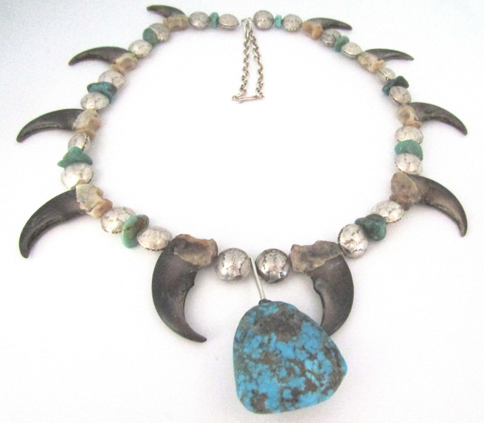 BEAR CLAW TURQUOISE SILVER DIME NECKLACE STERLING: 33 INCHES LONG WITH A 200CT KINGMAN TURQUOISE CENTER 44MM BY 42MM, 10 BEAR CLAWS, 44 US MERCURY DIMES, STERLING SILVER LINK CHAIN. TOTAL WEIGHT 216.0 GRAMS. EXCELLENT CONDITION. USA SHIPPING $5.