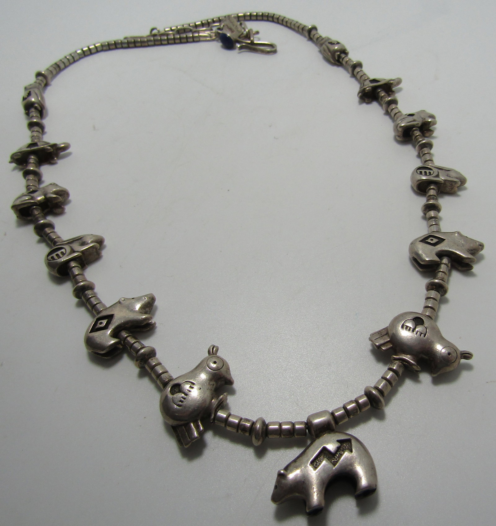 CHRISTIN WOLF FETISH NECKLACE STERLING SILVER 141G: 2 STRANDS OF HIGH GRADE 8MM TURQUOISE AND LAPIS. OLD PAWN FABULOUS SIGNED "CHRISTIN WOLF STERLING" 13 ANIMAL CHARMS. OLD PAWN NATIVE AMERICAN SOUTHWEST INDIAN NAVAJO JEWELRY. MEASURES 28 INCHES LONG. 