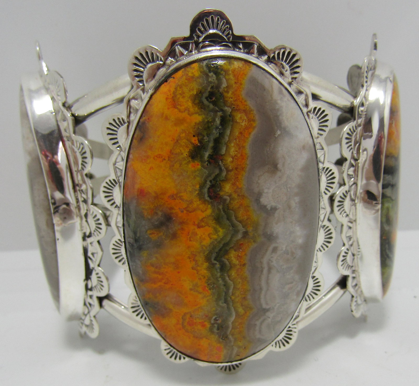 SAN FELIPE BUMBLE BEE JASPER BRACELET STERLING CUF: MONUMENTAL AGATE SILVER CUFF SIGNED " SAN FELIPE JACOB TRONCOSA STERLING". NATIVE AMERICAN SOUTHWEST INDIAN JEWELRY. CENTER STONE MEASURES 65MM LONG BY 43MM WIDE. WEIGHS 126.8 GRAMS. FITS AN 8 INCH WR