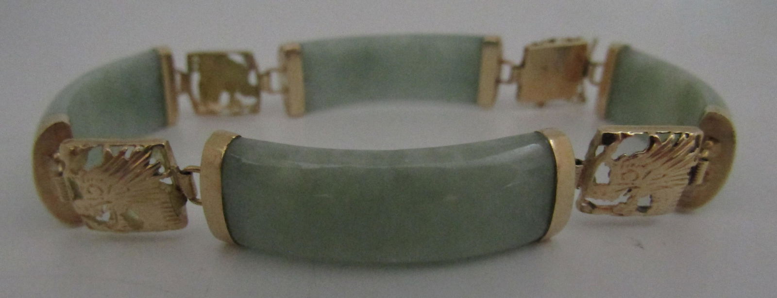 14K GOLD JADE BRACELET DRAGON LINK 15.8GRAMS: VINTAGE ESTATE 14KT YELLOW GOLD WITH DRAGON DESIGN. 10MM WIDE BY 7 INCHES LONG. WEIGHS 15.8 GRAMS. EXCELLENT USED CONDITION. USA SHIPPING $5.