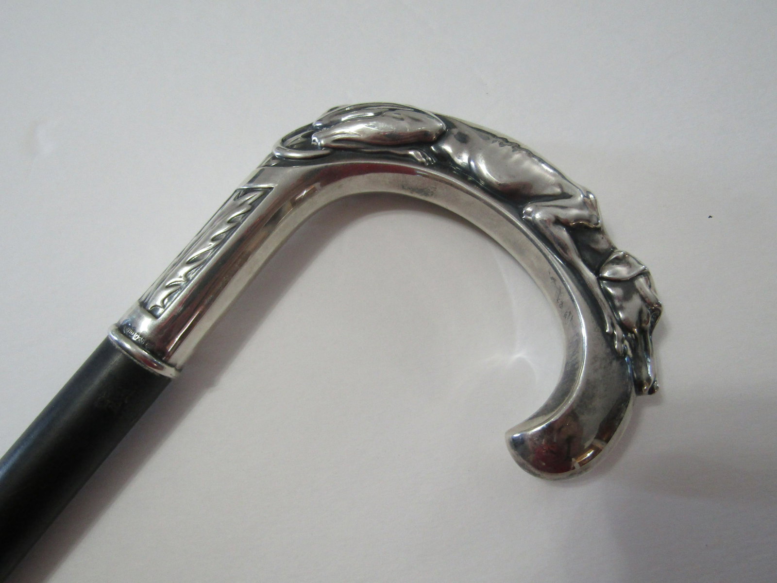 STERLING SILVER DOG CANE ENGLISH HALLMARKS: STERLING RECLINING HOUND ON LOOP. 4 1/2 INCH LOOP, 37 INCHES LONG 3/4 INCH SHAFT. EXCELLENT CONDITION NO DINGS. USA SHIPPING $20