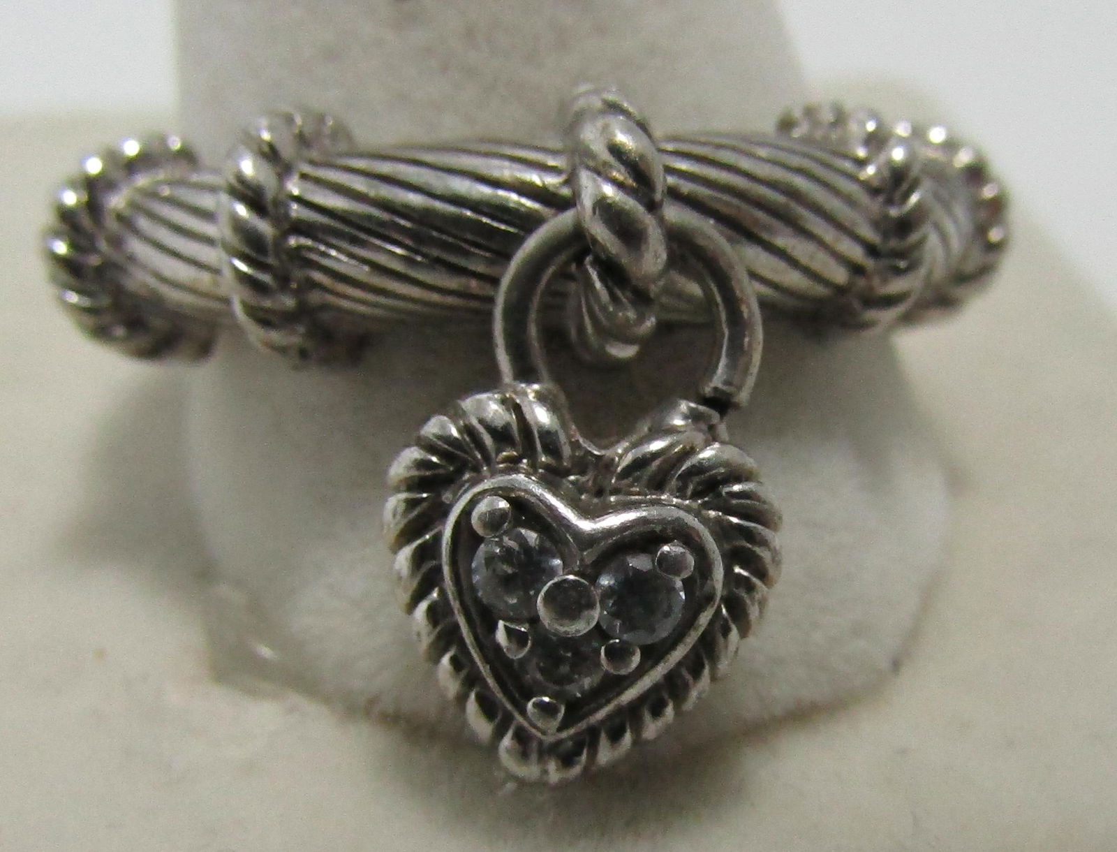 JUDITH RIPKA STERLING SILVER CZ SIZE 10: MARKED "JUDITH RIPKA 925. VINTAGE ESTATE 6MM WIDE ON TOP; PLUS 13MM HEART. SIZE 10. WEIGHS 6.3 GRAMS. EXCELLENT USED CONDITION. USA SHIPPING $5.