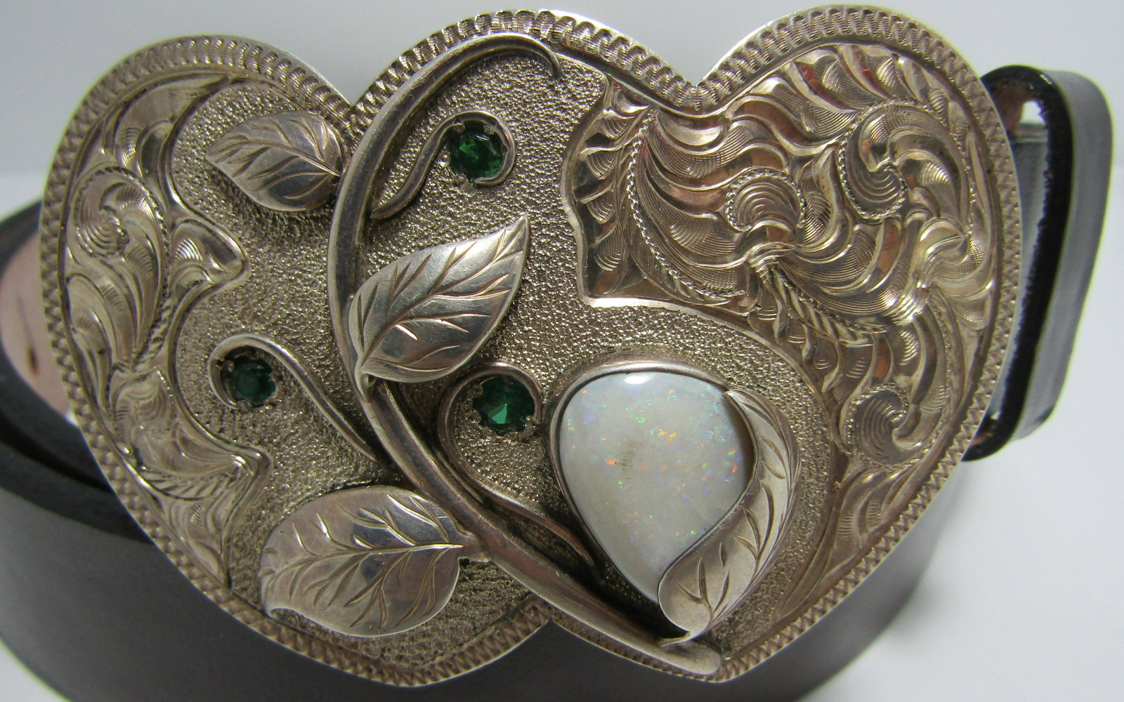OPAL ENGRAVED COWGIRL BELT BUCKLE STERLING SILVER: GENUINE HUGE OPAL WESTERN COWGIRL SIGNED "STERLING MADE IN USA WR" AND TESTED STERLING SILVER. BUCKLE MEASURES 85MM BY 57MM. WEIGHS 72.2 GRAMS. LEATHER MEASURES 45" BY 1.25"; FITS A 38" TO 44" WAIST. 
