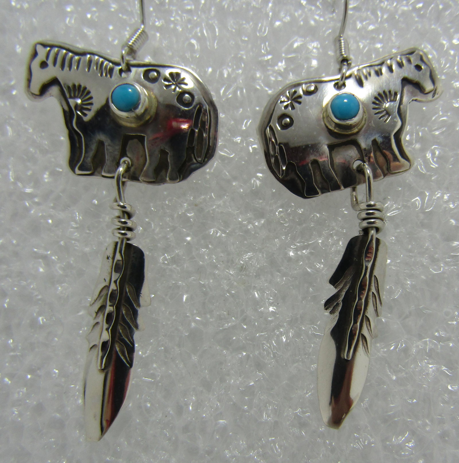 "JJJ" TURQUOISE EARRINGS STERLING SILVER HORSE: SIGNED "JJJ STERLING" JEFF JONES JR.HORSE WITH FEATHER NATIVE AMERICAN SOUTHWEST NAVAJO INDIAN JEWELRY. MEASURE 2 INCHES LONG. WEIGH 4.3 GRAMS. EXCELLENT CONDITION. USA SHIPPING $5.