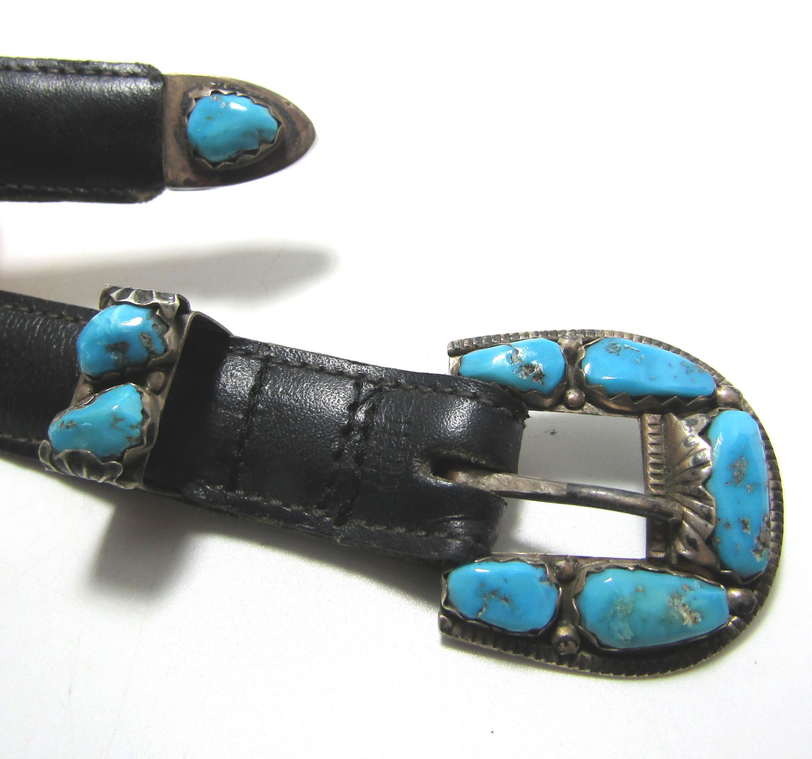 OLD PAWN PENKETEWA ZUNI TURQUOISE STERLING BELT: MATCHING THREE PIECE BELT BUCKLE SIGNED "A PENKETEWA" FOR AFONSO PENKETEWA ZUNI NATIVE AMERICAN INDIAN ARTIST. 38.5" LONG AND 3/4" WIDE. WEIGHS 48 GRAMS INCLUDING LEATHER. ANNE KLEIN 8234 LEATHER SHOW
