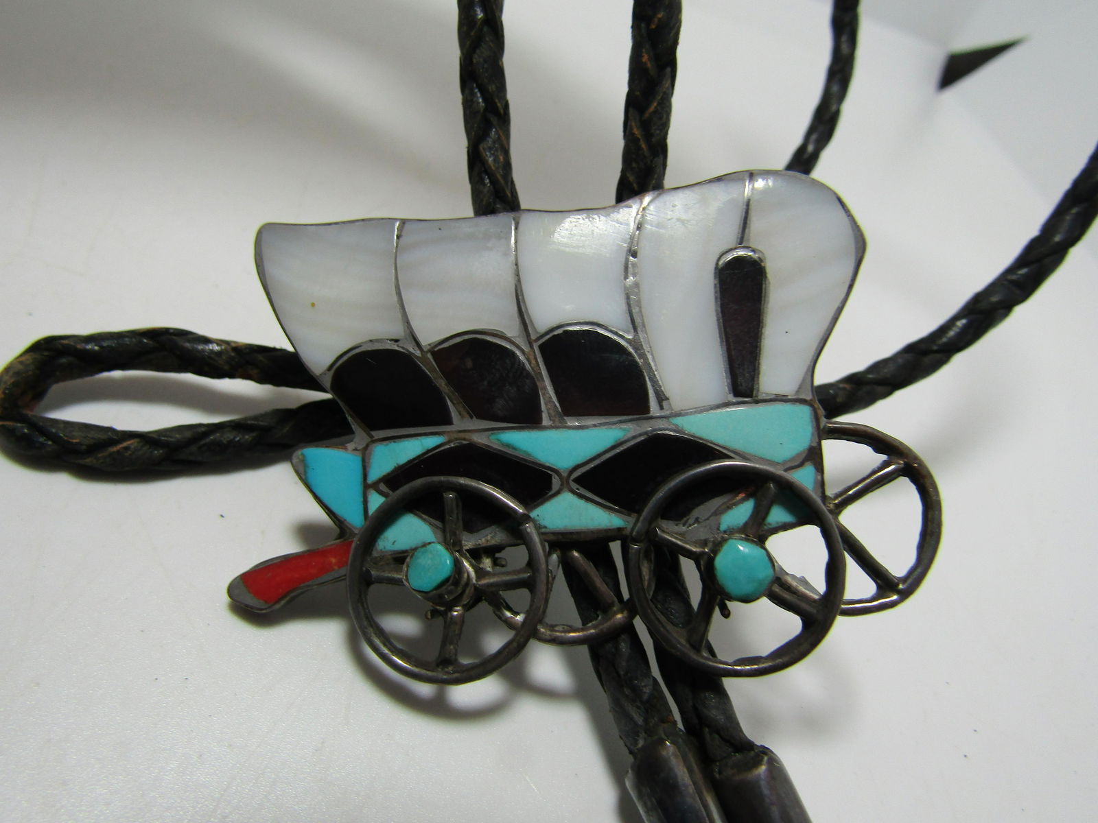 1970'S SIGNED "WILLIE ZUNI" STERLING WAGON BOLO (1 of 4)