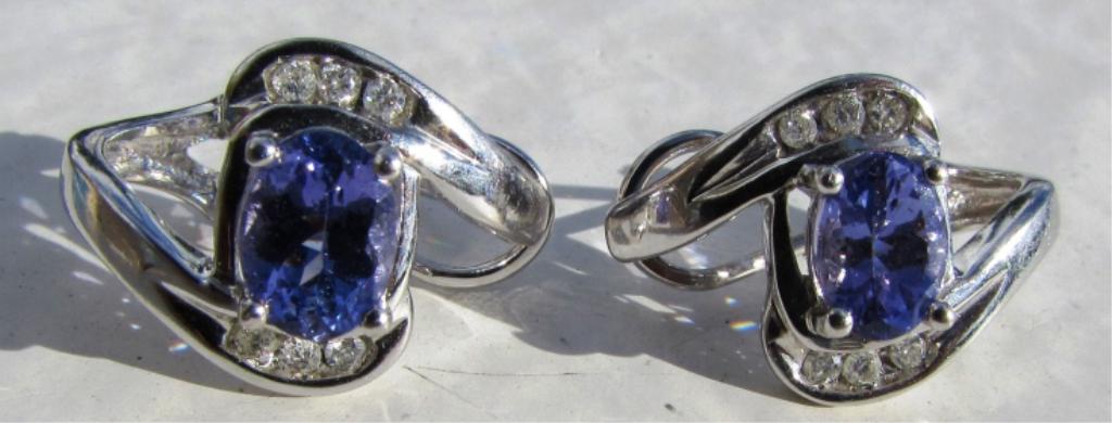 3CT TANZANITE & DIAMOND EARRINGS 14K GOLD PIERCED: ALL GENUINE14K WHITE GOLD EARRINGS WITH 3 CARAT TANZANITE AND 12 DIAMONDS. MEASURE 18MM BY 13MM. WEIGH 4.7 GRAMS. CLIP AND POST. EXCELLENT CONDITION. USA SHIPPING $5
