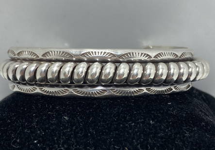 45 GRAM STERLING NATIVE AMERICAN COIL BRACELET: NATIVE AMERICAN CUFF BRACELET. UNSIGNED MARKED TESTED STERLING SILVER. HEIGHT IS 1/2". GAP IS 1-1/4" FLEXIBLE AND FITS 6.5" WRIST TOTAL. WEIGHS 45 GRAMS. USA SHIPPING $5.