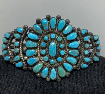 1965 OLD PAWN STERLING TURQUOISE CLUSTER BRACELET: VINTAGE OLD PAWN HANDMADE NATIVE AMERICAN ZUNI CUFF BRACELET. GENUINE PETIT POINT TURQUOISE STONES (NOT BLOCK). SIGNED "MARY MALONEY OCT 4 1965 75,793". WEIGHS 35 GRAMS. TESTED STERLING SILVER. HEIGHT